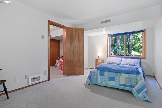 carpeted bedroom with baseboards and visible vents