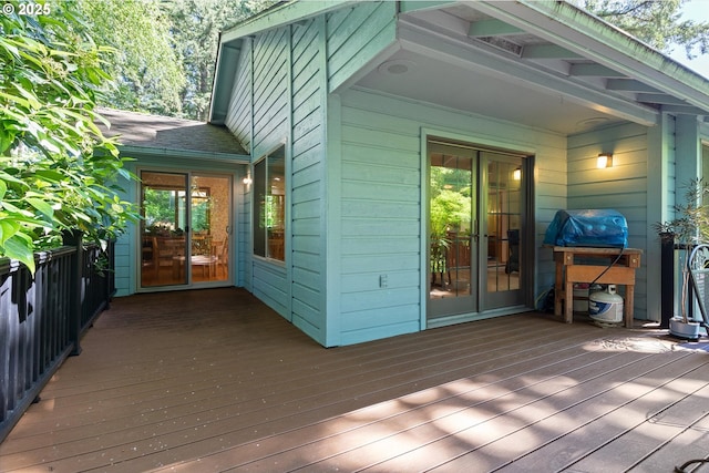 deck with french doors and grilling area