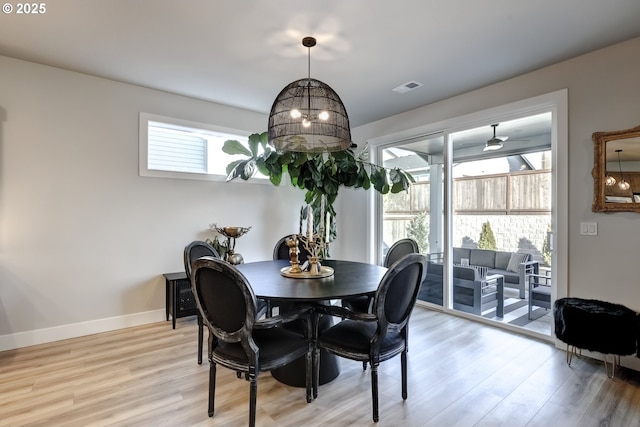 dining space featuring a wealth of natural light and light hardwood / wood-style floors