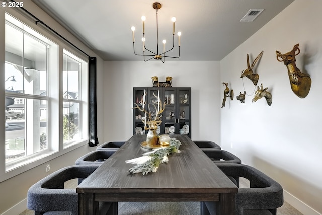 dining room with a chandelier