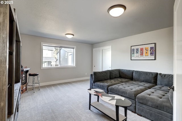 carpeted living room with a textured ceiling