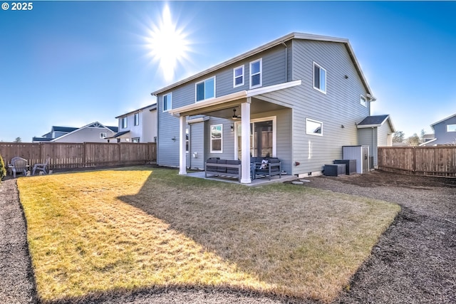 rear view of house featuring a yard, an outdoor hangout area, ceiling fan, and a patio area