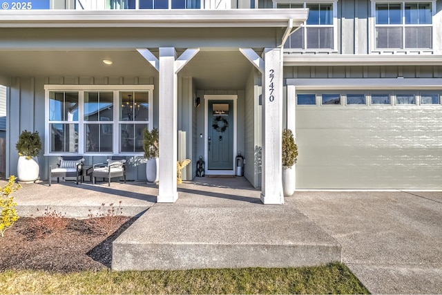 view of exterior entry with a garage