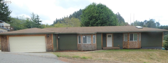 single story home featuring an attached garage