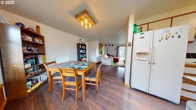 dining area with wood finished floors