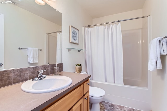 full bathroom featuring tile patterned flooring, vanity, shower / tub combo, and toilet