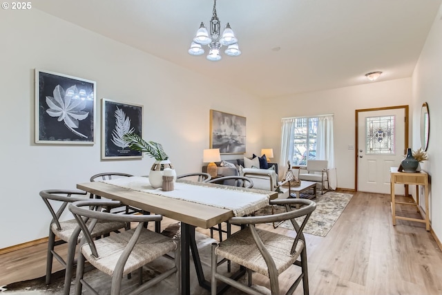 dining room featuring a chandelier and light hardwood / wood-style flooring