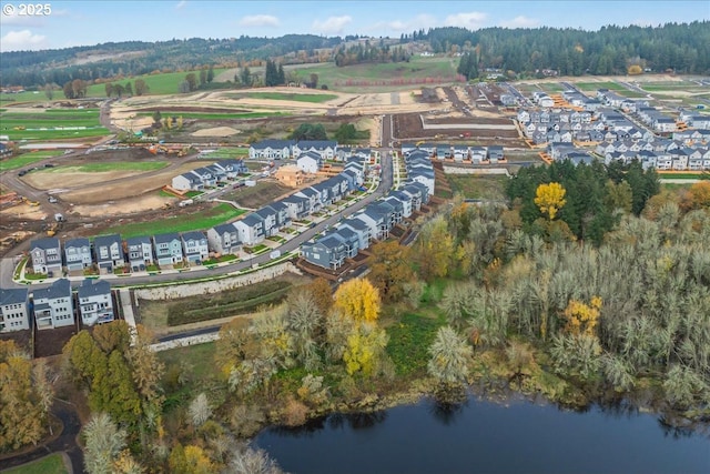 birds eye view of property featuring a water view and a residential view