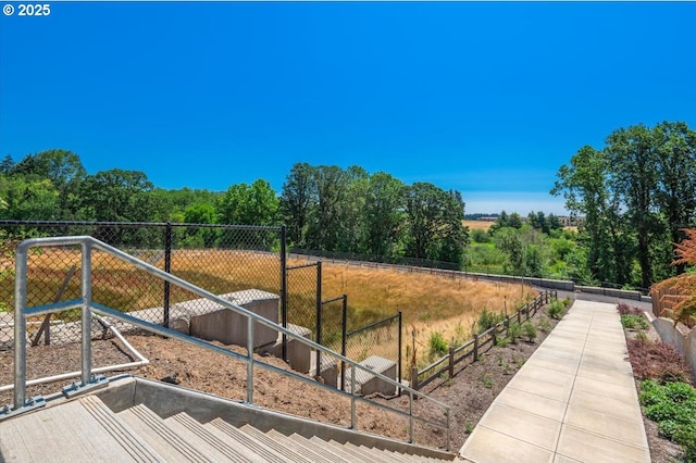 view of community with fence