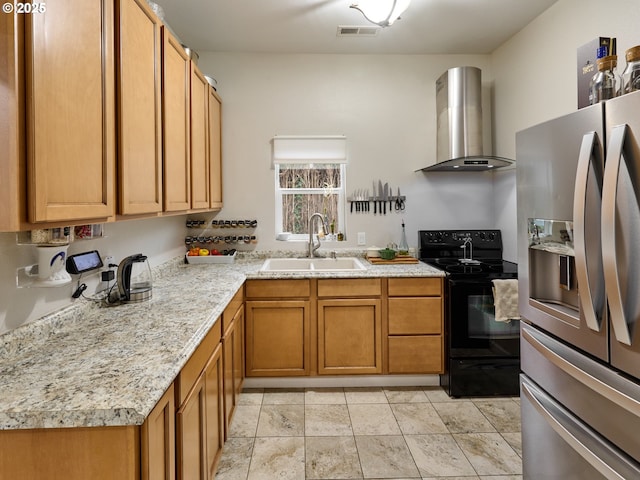 kitchen featuring wall chimney range hood, black electric range, stainless steel refrigerator with ice dispenser, and sink