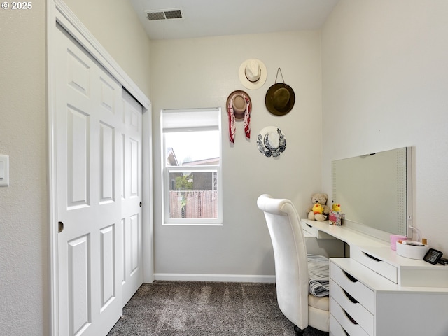 carpeted office featuring built in desk