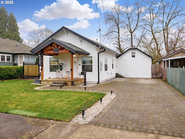 bungalow featuring a front lawn and a porch