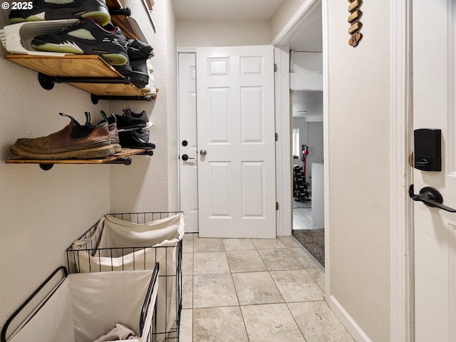 mudroom featuring light tile patterned flooring