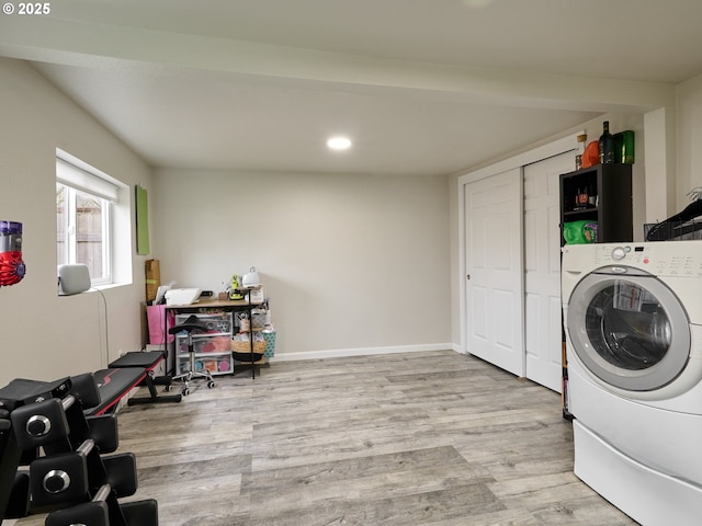 laundry room with light hardwood / wood-style floors and washer / clothes dryer