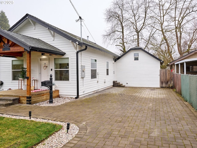 back of property featuring a patio area