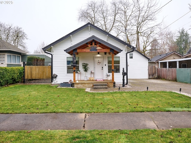 bungalow-style house featuring a porch and a front lawn