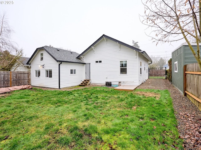 rear view of house with a lawn