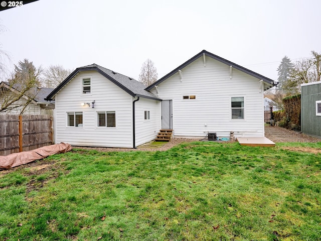 back of property with a lawn and a patio