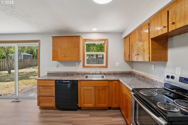 3259 SE 176th Pl, Portland, OR 97236 - kitchen with dishwasher, stainless steel range with electric cooktop, healthy amount of natural light, light wood-style flooring, and recessed lighting
