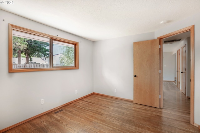 3259 SE 176th Pl, Portland, OR 97236 - spare room with wood finished floors and a smoke detector
