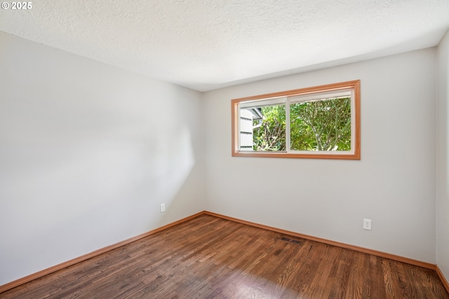 3259 SE 176th Pl, Portland, OR 97236 - empty room featuring wood finished floors and a textured ceiling