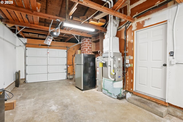 3259 SE 176th Pl, Portland, OR 97236 - garage with freestanding refrigerator, a garage door opener, water heater, and heating unit