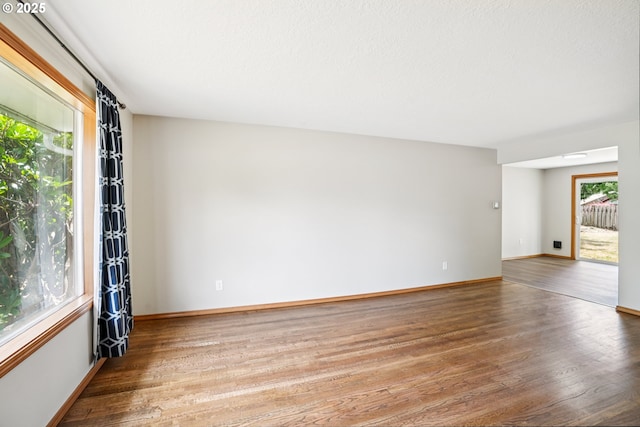 3259 SE 176th Pl, Portland, OR 97236 - unfurnished room with plenty of natural light and wood finished floors