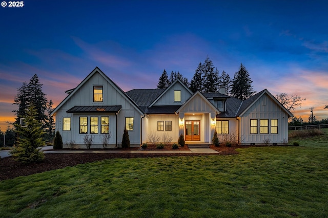 view of front facade with crawl space, a standing seam roof, a front lawn, and board and batten siding