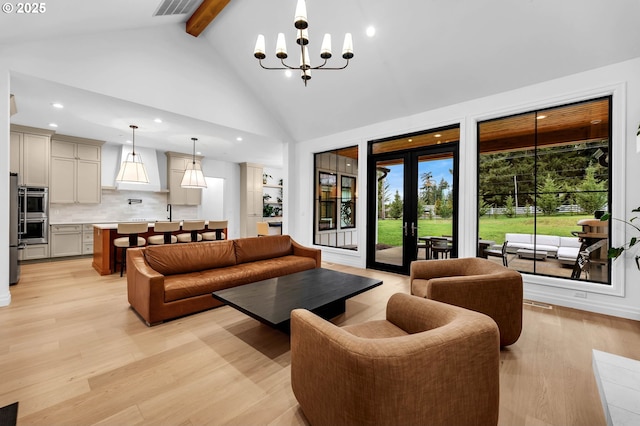 living area featuring high vaulted ceiling, light wood-style floors, beamed ceiling, and a notable chandelier