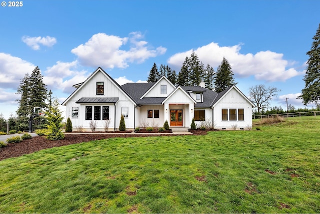 modern inspired farmhouse featuring a shingled roof, a standing seam roof, fence, board and batten siding, and a front yard