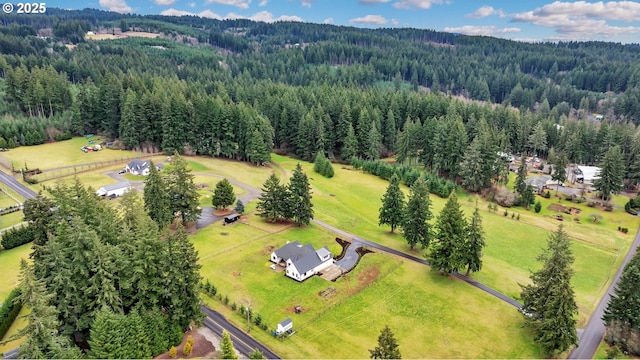 bird's eye view with a rural view and a forest view