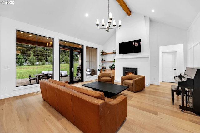 living area featuring a warm lit fireplace, high vaulted ceiling, beam ceiling, and light wood-style floors