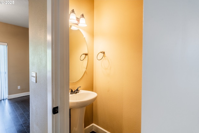 bathroom with wood-type flooring