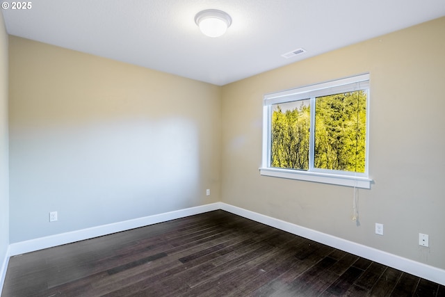 unfurnished room featuring hardwood / wood-style flooring