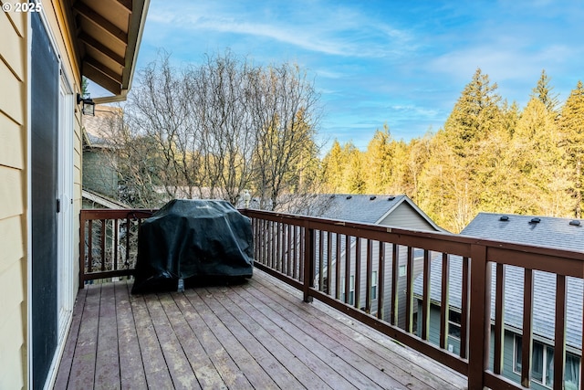 wooden deck featuring area for grilling