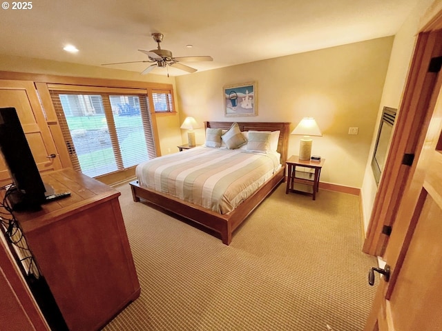 bedroom with light colored carpet and ceiling fan