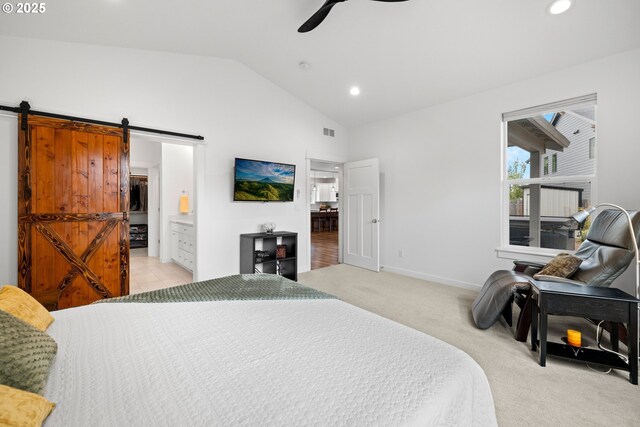1046 SE Olive Way, Estacada, OR 97023 - bedroom featuring a barn door, vaulted ceiling, recessed lighting, light carpet, and ensuite bath