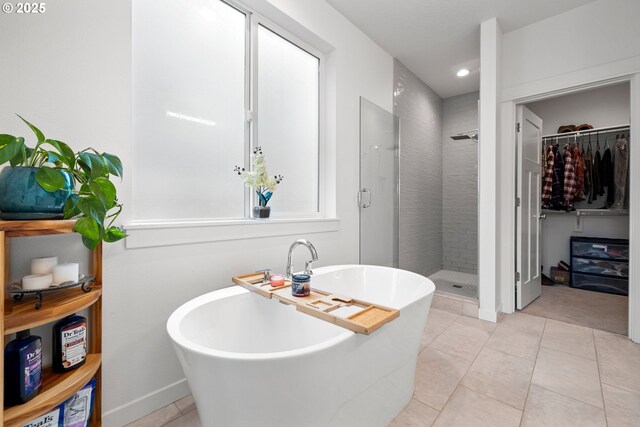 1046 SE Olive Way, Estacada, OR 97023 - bathroom with a shower stall, a walk in closet, tile patterned floors, a freestanding tub, and recessed lighting