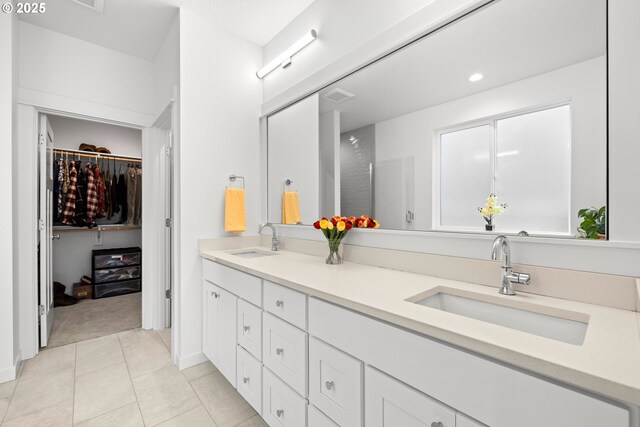 1046 SE Olive Way, Estacada, OR 97023 - full bathroom with double vanity, a spacious closet, tile patterned floors, and recessed lighting