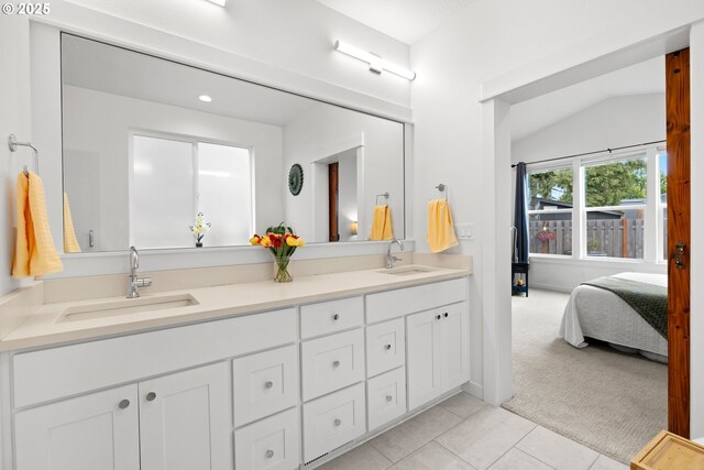 1046 SE Olive Way, Estacada, OR 97023 - ensuite bathroom featuring double vanity, tile patterned floors, vaulted ceiling, and recessed lighting