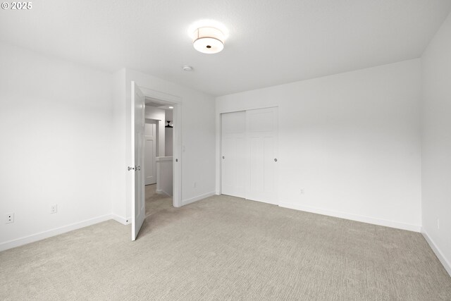 1046 SE Olive Way, Estacada, OR 97023 - unfurnished bedroom with light carpet, baseboards, and a closet