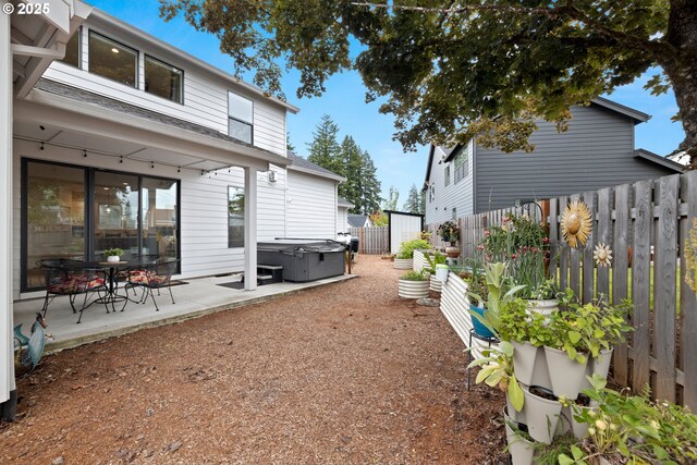 1046 SE Olive Way, Estacada, OR 97023 - fenced backyard featuring a patio area and a hot tub