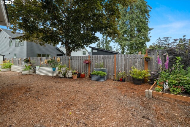 1046 SE Olive Way, Estacada, OR 97023 - fenced yard featuring a vegetable garden