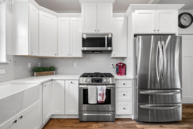 1046 SE Olive Way, Estacada, OR 97023 - kitchen with appliances with stainless steel finishes, light countertops, white cabinetry, and dark wood-style floors