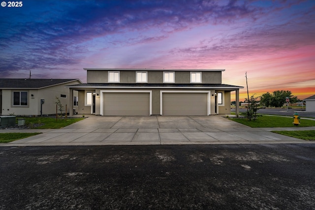1129 NE Emerald Dr, Hermiston, OR 97838 - traditional-style home featuring concrete driveway, stucco siding, and a garage