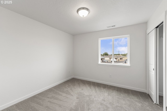 1129 NE Emerald Dr, Hermiston, OR 97838 - unfurnished bedroom with carpet flooring, baseboards, and a closet