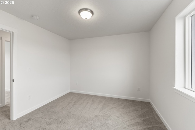 1129 NE Emerald Dr, Hermiston, OR 97838 - carpeted spare room featuring baseboards and a smoke detector