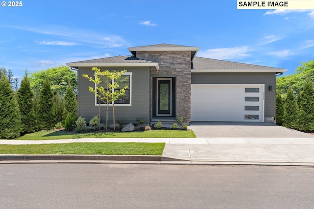 5133 N Benton Dr, Camas, WA 98607 - view of front of property featuring a garage, stone siding, concrete driveway, and a front yard