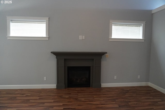 unfurnished living room featuring dark wood-type flooring