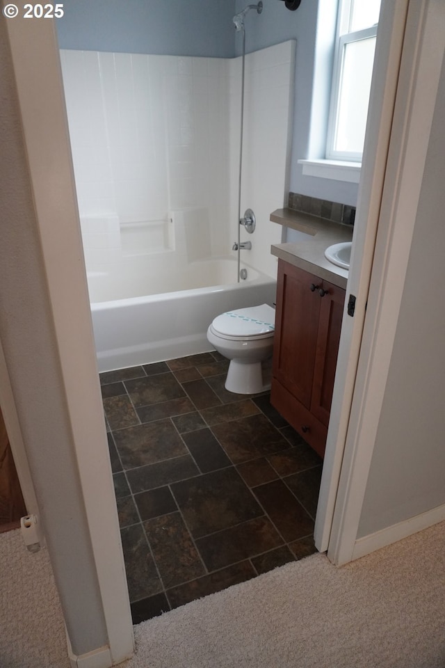 full bathroom with toilet, vanity, and  shower combination